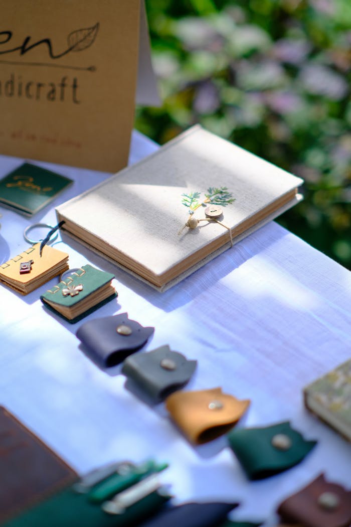 Elegant display of handcrafted notebooks and leather goods, bathed in natural sunlight, ideal for creative inspiration.